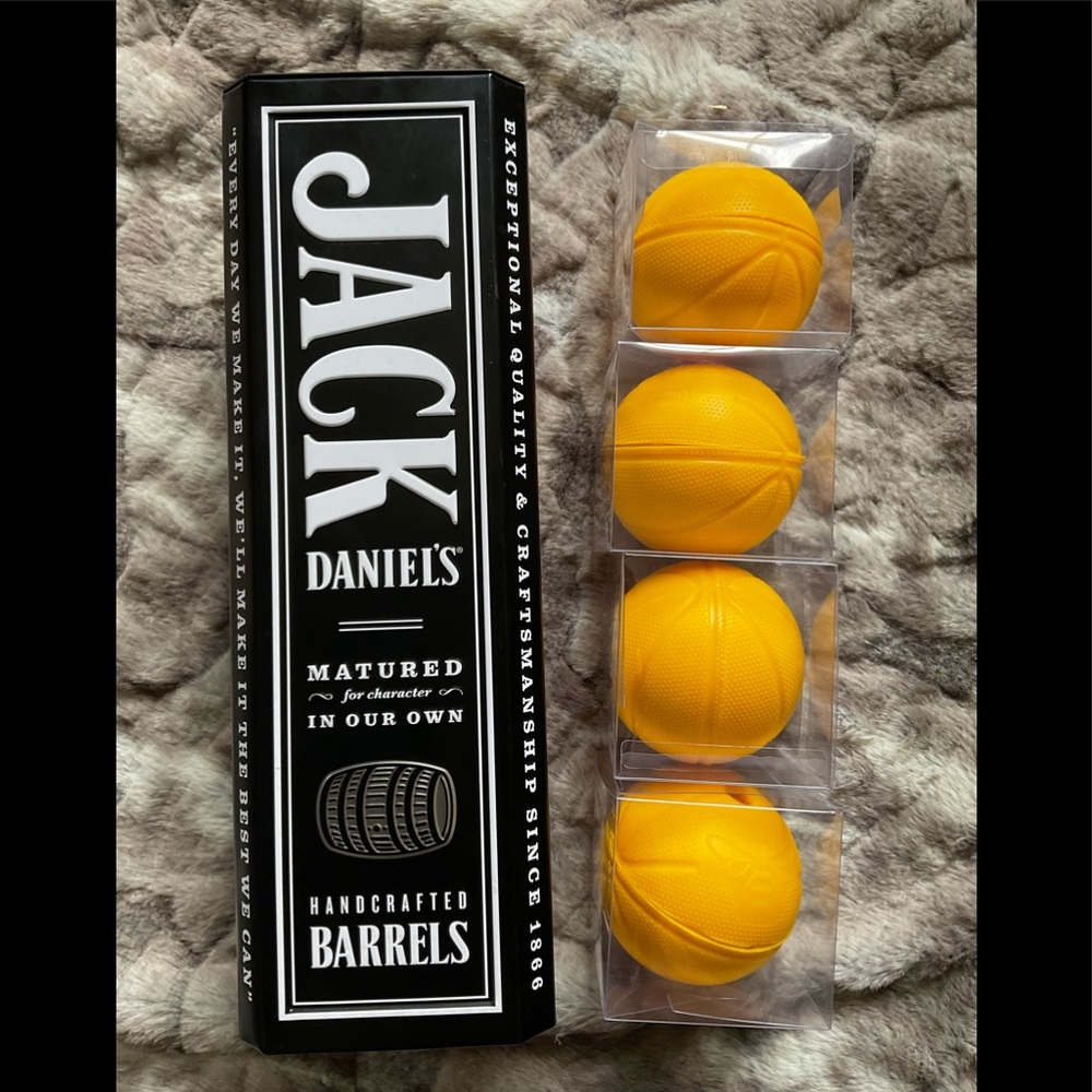 Jack Daniel’s collectible tin with  4 basketball ice sphere molds.